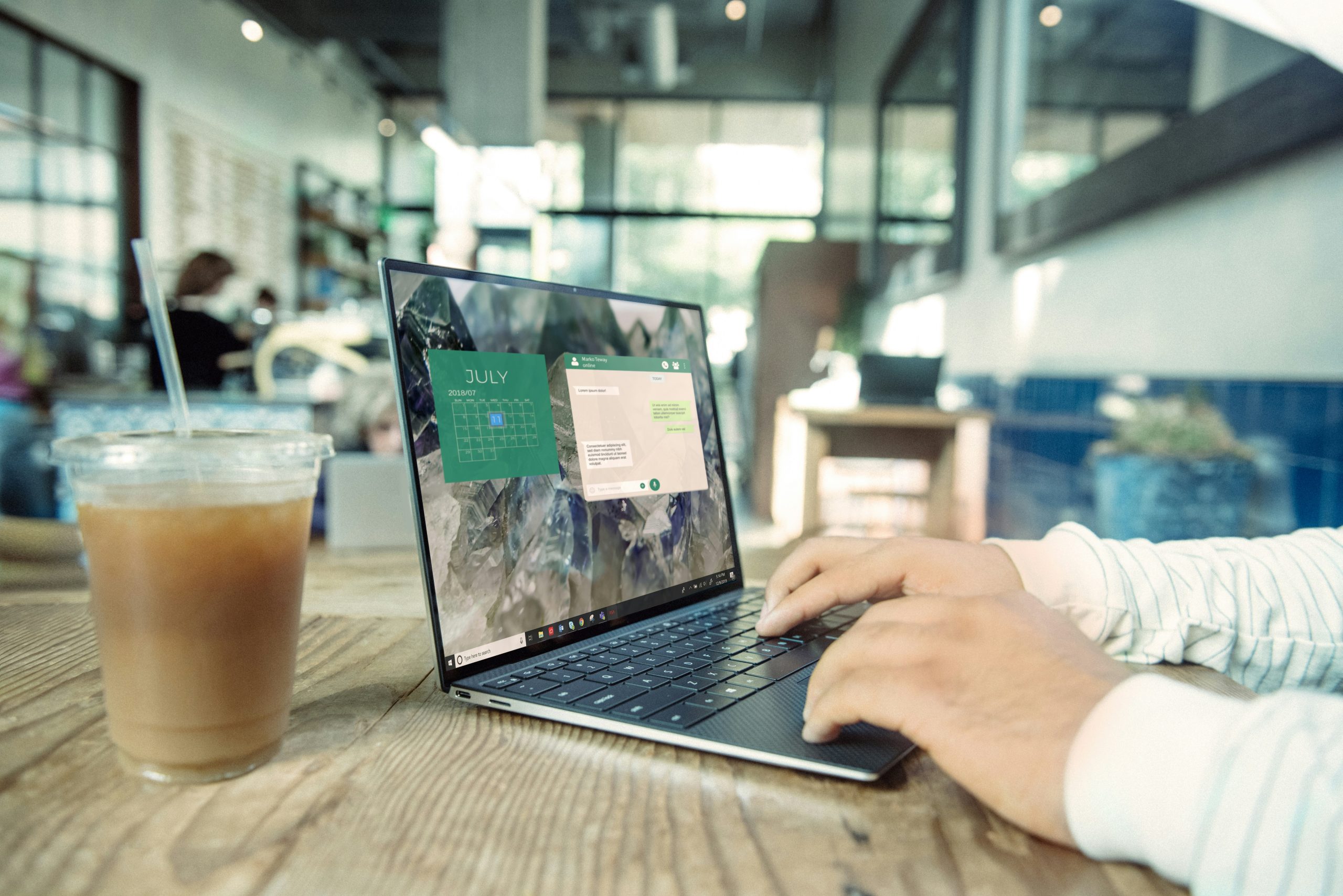 Graphic designer’s desk with icons of top design software in 2026